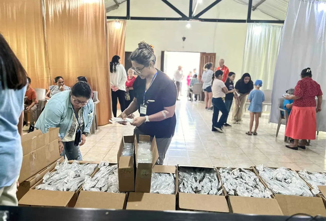 Community members gathered with FaithCare Outreach volunteers